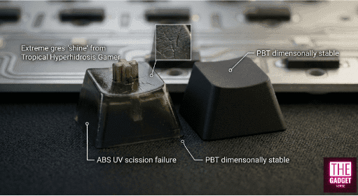 Comparison between a shiny, worn ABS keycap and a textured PBT keycap