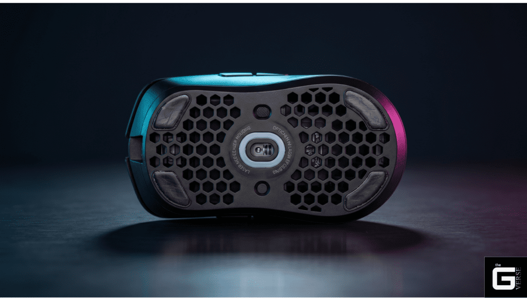 Honeycomb gaming mouse bottom with optical sensor.