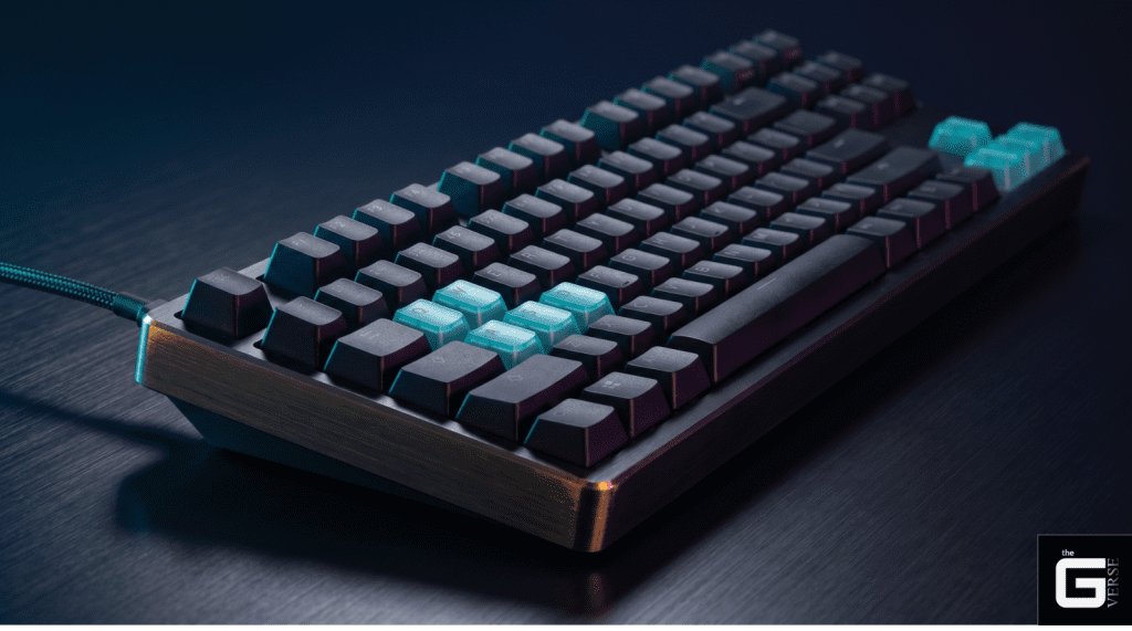 Gaming keyboard with teal WASD keycaps highlighting SOCD movement keys used in competitive FPS games