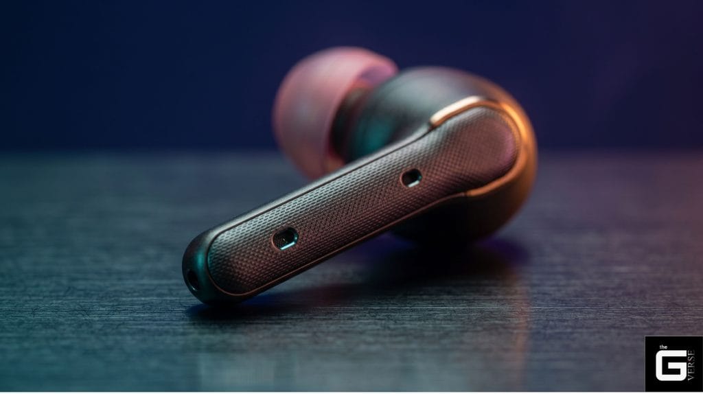 TWS earbud stem with dual microphone holes close-up