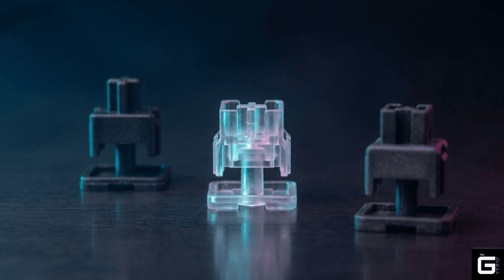 Three different keyboard switch stem designs standing side by side