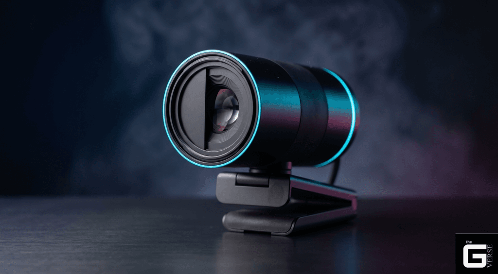 Black webcam with glowing ring light and half-open privacy shutter